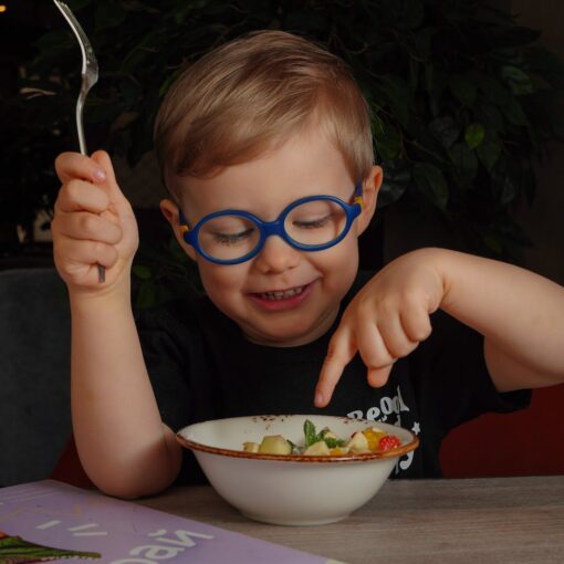 little boy eating a meal