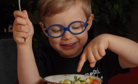 little boy eating a meal