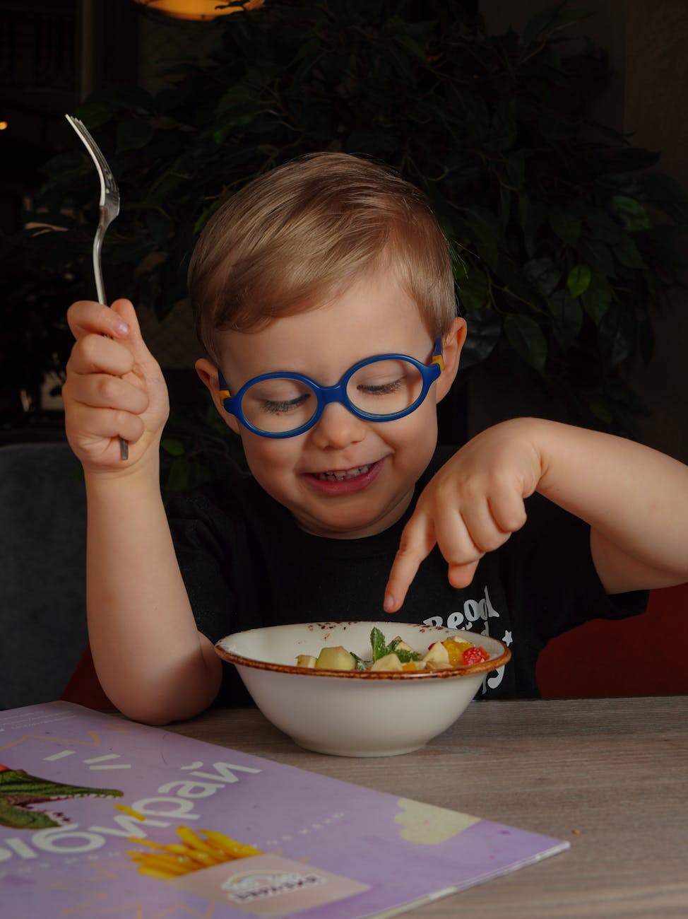 little boy eating a meal